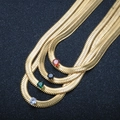 Flat gold snake chain necklace with four colors of sparkling round-cut gemstones - Black Rhinestone / Gold Necklace