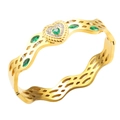 Gold wave hollow bangle with heart-shaped green gemstone and white diamond accents - Hollow Heart Green Rhinestone Style (BMG544G)