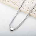 Detail of silver tennis necklace featuring a polished heart pendant and sparkling zircons - Heart Necklace-Silver