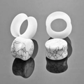 Detail view of natural marble stone and translucent white double flared ear gauge plugs - 6mm White Turquoise Silicone 2 Pairs