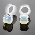 Macro detail of polished synthetic opal ear plugs and tunnels with iridescent finish - 6mm Opal Stone Silicone 2 Pairs