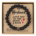 Close-up of black volcanic rock bead bracelet with moonstone in a kraft gift box - To My Husband