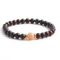 Red tiger eye stone beaded bracelet with gold spacers and a pink accent bead - Red/Pink
