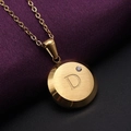 Golden round pendant necklace featuring letter D with brushed finish and zircon accent - Gold D