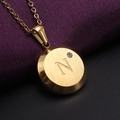 Gold stainless steel necklace featuring a round letter N pendant with a sparkling zircon - Gold N
