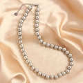 Polished silver stainless steel bead necklace with lobster clasp on silk fabric - Silver 10mm