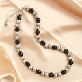 Silver and black stainless steel beaded necklace displayed on silk fabric background - Silver Black 10mm