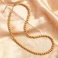 Collar de cuentas doradas de acero inoxidable sobre satén con colgante de corazón - Dorado 6mm