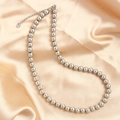 Polished 4-10mm stainless steel bead necklace on champagne satin with lobster clasp detail - Silver 8mm