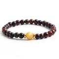 Handmade red tiger eye beaded bracelet with a yellow contrast stone and gold spacers - Red/Yellow