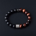 Close-up of matte black beads and tiger eye stone bracelet with silver spacers - 8mm / 8mm Red Tiger Eye & Matte Stone