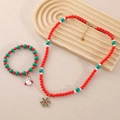 Weihnachts-Schmuckset mit rot-grünen Perlen und goldenen Schneemann-Anhängern - Schneeflocken Halskette und Schneemann Armband Set (NY01-7 NY01-8)