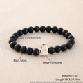 Detail of 8mm matte black glass beads and a beige turquoise elephant charm bracelet - Frosted Black Glass Beige Turquoise (NZ01-10)
