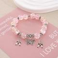 Pulsera de cuentas de vidrio rosa y naranja con dijes de mariposa y lazo plateados - Diámetro de perla 10mm / Degradado Rosa y Naranja
