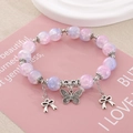 Elegante pulsera de cuentas de vidrio violeta con delicados dijes de mariposa de plata - Diámetro de perla 10mm / Degradado Púrpura Claro y Rosa