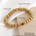 Beaded stainless steel bracelet with 18K gold plating and a red stone ornament - 5mm / January