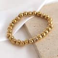 18K gold plated beaded stretch bracelet featuring a single sparkling zircon accent - 5mm / April