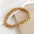 Polished 18K gold plated beaded stretch bracelet with yellow crystal accent bead - October