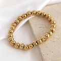 Polished 18K gold plated beaded stretch bracelet featuring a single sparkling zircon bead - November