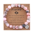Pink zebra jasper Pisces zodiac beaded bracelet with silver charm on display card - Steel / Pisces