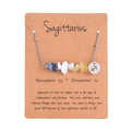 Sagittarius zodiac necklace with natural crushed stones and silver pendant on display card - Sagittarius