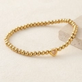 Golden beaded stainless steel bracelet featuring a champagne heart zircon pendant - Brown
