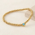 Golden beaded stainless steel bracelet featuring a light blue heart zircon pendant - Blue Turquoise