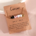Cancer zodiac necklace with natural crystal stones and golden pendant on display card - Cancer (XS-15-JX)