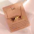 Gold-tone Leo zodiac necklace featuring mixed natural crystal stones and a circular pendant - Leo (XS-15-SZI)
