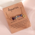 Aquarius zodiac necklace with crystal gravel and golden pendant on display card - Aquarius (XS-15-SP)