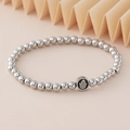 Elastic stainless steel beaded bracelet with Hamsa Hand charm on pink background - Hamsa Hand Charm (NAD03-2) / 5mm Non-fading Stainless Steel