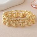 Vierteiliges goldenes Perlenarmband-Set mit strukturierten Perlen und glatten Kugeln - 3mm Kürbisperlen Armband Stapel