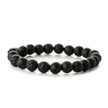 Bracelet élastique en perles de pierre de lave volcanique noire sur un fond blanc neutre - Pierre de lave