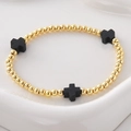 Pulsera de cuentas de cobre dorado con tres dijes de cruz negros para mujer elegante - Cruz Negra