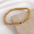 Gold beaded stainless steel bracelet featuring a turquoise gemstone birthstone charm - 5mm / March
