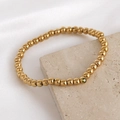 Bracelet à billes dorées avec zircon vert sur fond en soie et pierre naturelle - Août