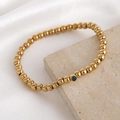 Bracelet minimaliste en perles dorées orné d'une seule pierre de zircon bleue ronde - Septembre