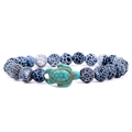 Bracciale di perle turchesi blu da 8mm con ciondolo tartaruga marina su sfondo bianco puro - Tartaruga Invecchiata Nero Opaco