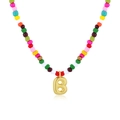 Colorful beaded necklace featuring a polished gold letter B pendant for layered jewelry styles - Letter B