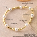 Stackable stretch bracelet with 18k gold plated copper beads and white shell pearls - Gold (3+4+6mm)