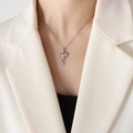 Molten lava style heart necklace with pink stone on model in white blazer - 40+5cm / Steel Pink