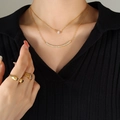 Double-layer gold stainless steel necklace with smile zircon pendant and matching rings - Gold