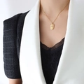 Artistic gold female body relief necklace with oval pendant on a delicate chain - 40+5cm / Gold