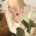 French vintage silver chain necklace with an elegant oval red pendant on a model - 40+5cm / Steel