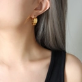 Polished gold wide heart-shaped hoop earrings for women in a minimalist modern style - Gold