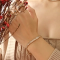 Chic 18k gold plated tennis bracelet featuring emerald-cut clear cubic zirconia stones - Champagne Zirconia Bracelet (E238)
