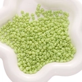 Pale green 5x5mm teardrop glass beads in a white bowl for DIY jewelry making - 450g/Pack (Approx. 4500 Pcs) 5x5mm, Hole ~1mm / Grass Green