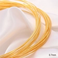 Macro detail of 0.7mm 18K gold plated copper wire for DIY jewelry making supplies - 0.7