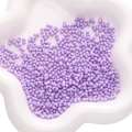 Light purple peanut-shaped acrylic beads for DIY jewelry making in a white ceramic tray - 3x6mm 10g/Pack About 260pcs / Purple