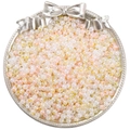 Mix of cream and peach 4mm glass seed beads in a decorative silver bow tray - NB Yellow Series